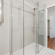 Cleaning Glass Shower Doors: A Guide to Eliminating Hard Water Stains and Soap Scum